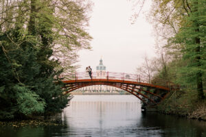 Schloss Charlottenburg is a great location for a pre-wedding walk photo session with corners of nature and the majestic architecture of the palace